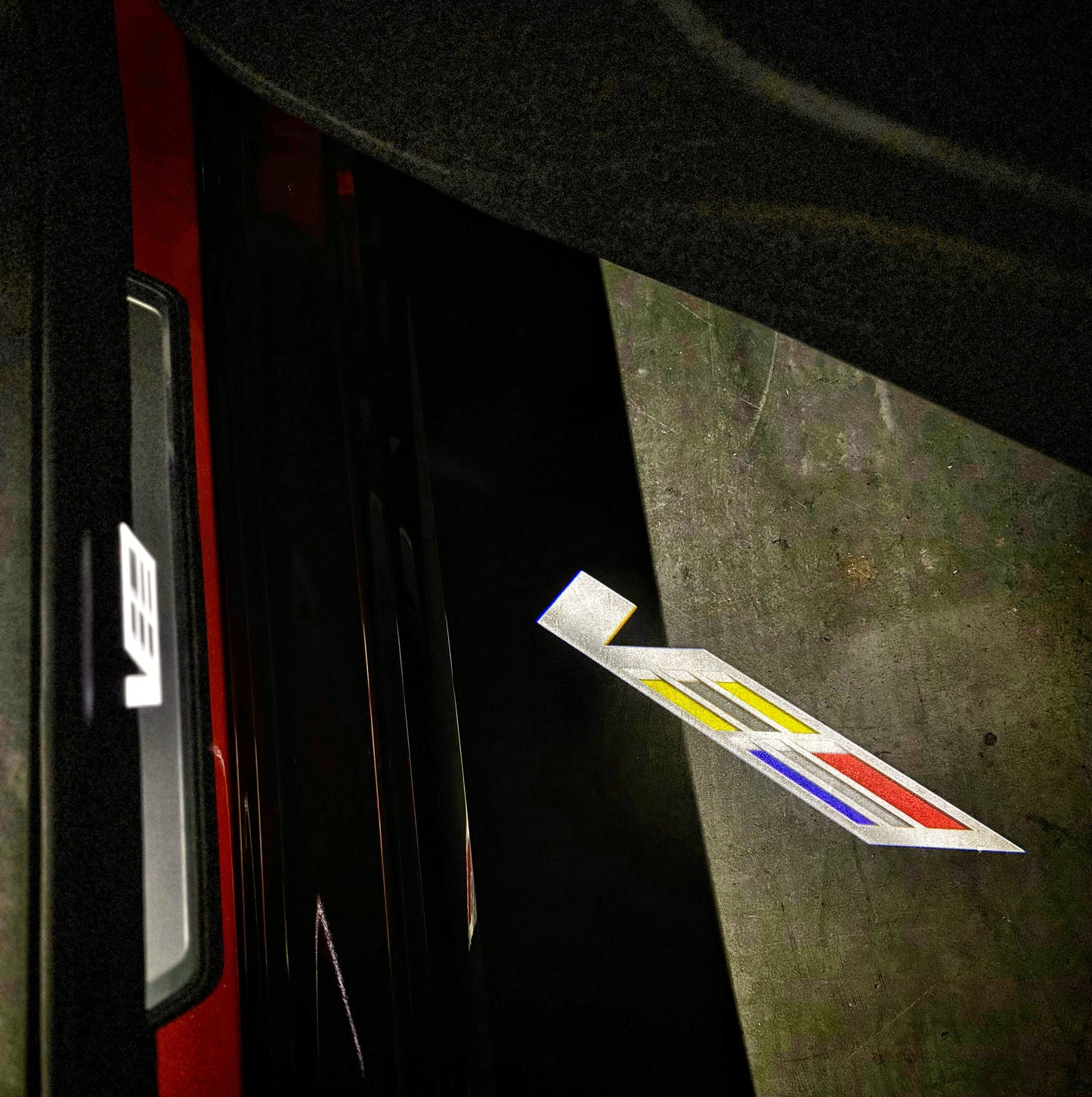 Courtesy Door Puddle Lights Colored "V-Series" Logo