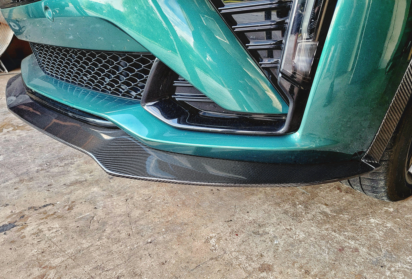 Cadillac 2025 2026 CT5-V CT5V front chin lip front splitter in Carbon Fiber or Gloss Black Fiberglass. OEM + American Aftermarket Upgrade Mods