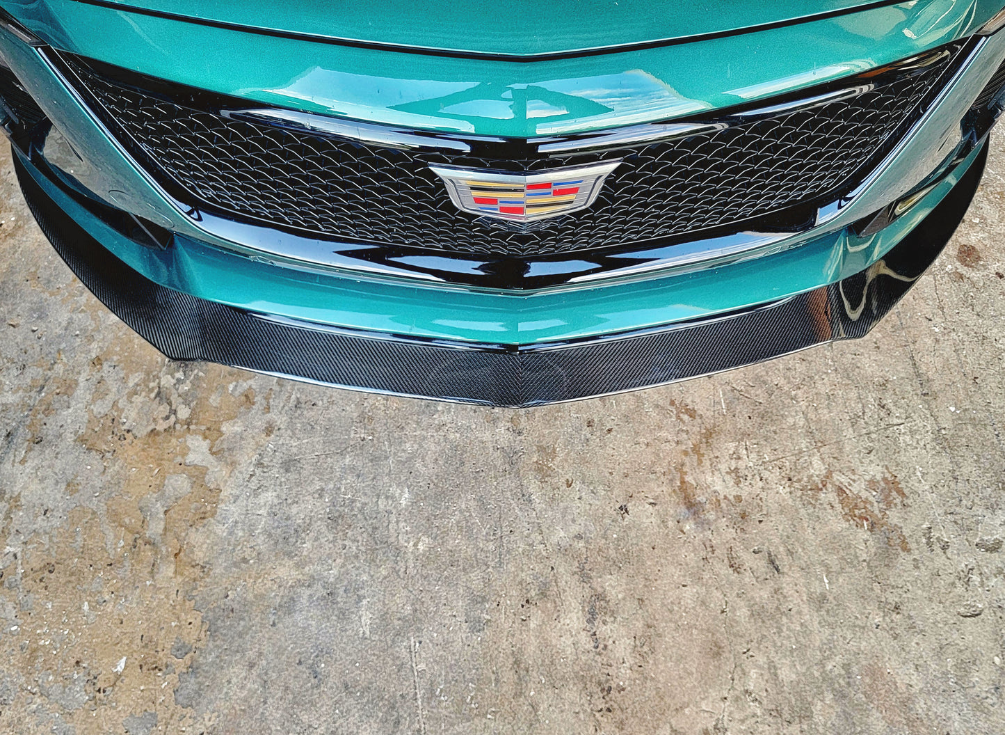 Cadillac 2025 2026 CT5-V CT5V front chin lip front splitter in Carbon Fiber or Gloss Black Fiberglass. OEM + American Aftermarket Upgrade Mods