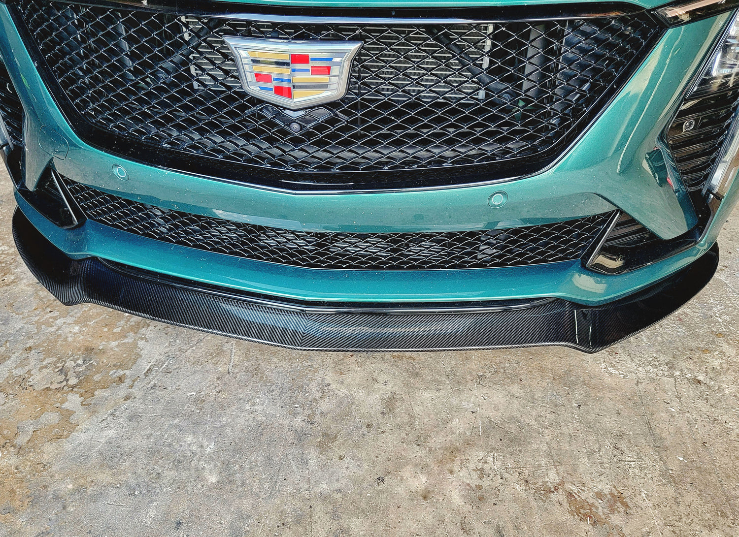 Cadillac 2025 2026 CT5-V CT5V front chin lip front splitter in Carbon Fiber or Gloss Black Fiberglass. OEM + American Aftermarket Upgrade Mods