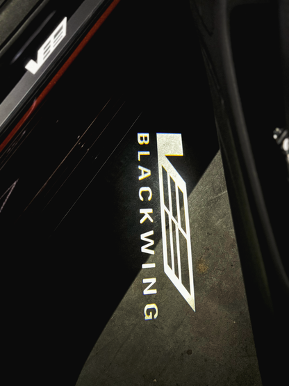 Courtesy Door Puddle Lights Monochrome "V-Series w/Blackwing Script" Logo